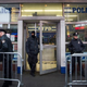 Police officers stand guard outside a New York City Police Department substation in Times Square Dec. 22, 2014.
Andrew Burton/Getty Images
